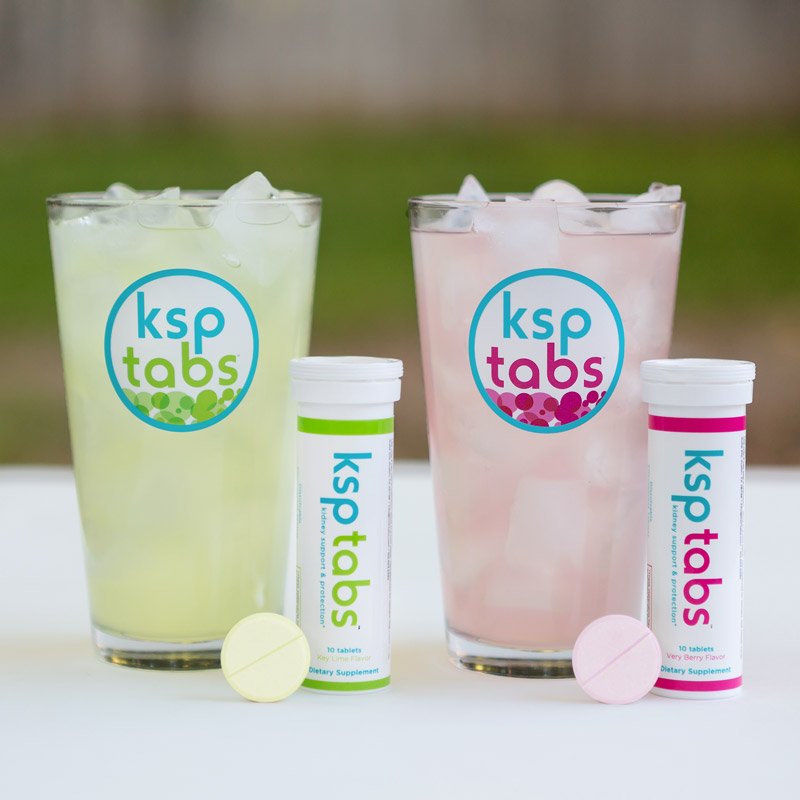 Lime KSPtabs and Berry KSPtabs with a glass of each.
