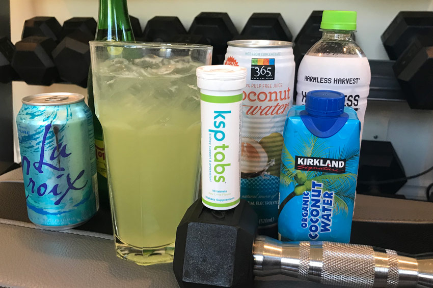 Lime KSP tab next to coconut water and plain sparkling water.