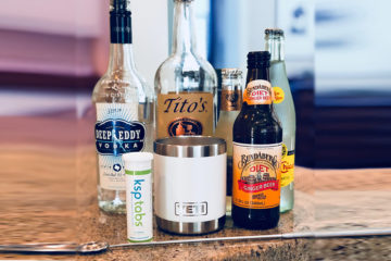 Lime KSP tabs next to various vodka bottles and a white Yeti tumbler.