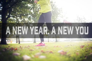 Someone exercising in the park with a banner across the image reading "A New Year. A New You"