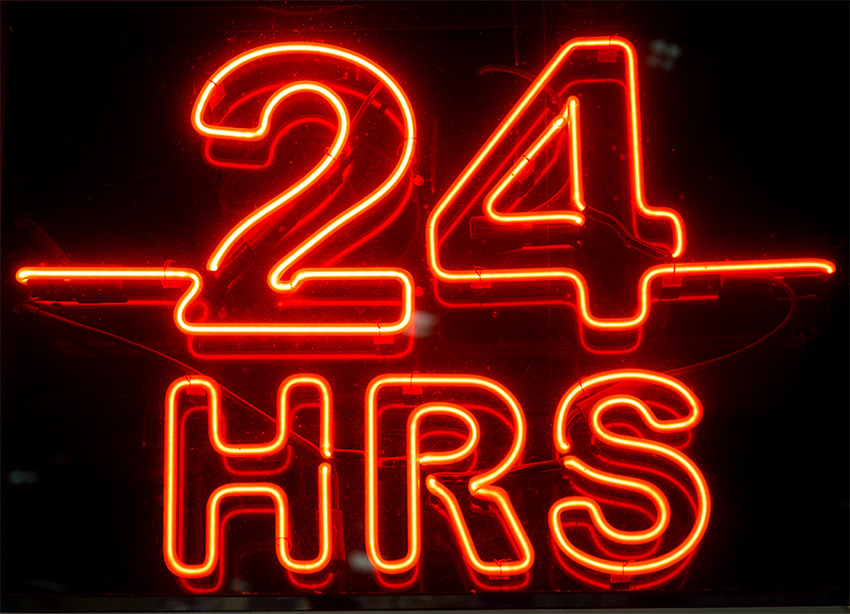A neon sign displaying 24 hours