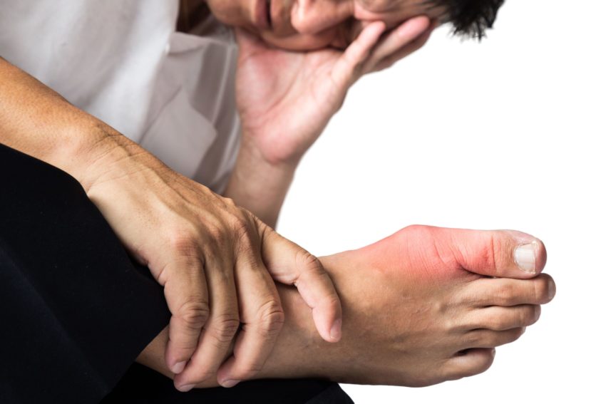 A man experience a painful foot. Showing gout pain.