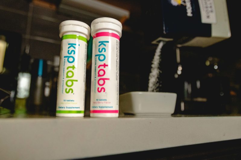 A tube of lime and berry KSPtabs sits on a kitchen counter top.