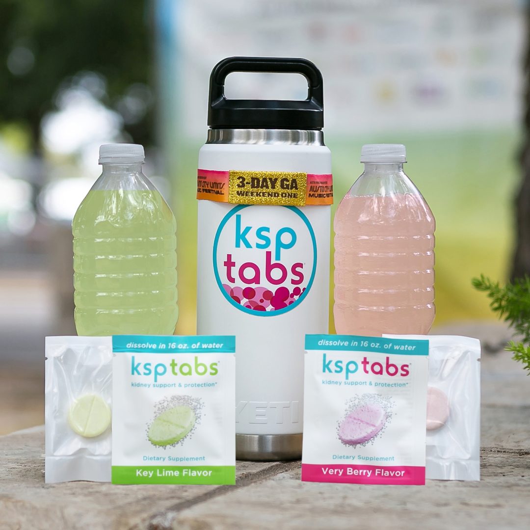 KSPtab sample pouches with drinks and a tumbler at the ACL Music Festival.